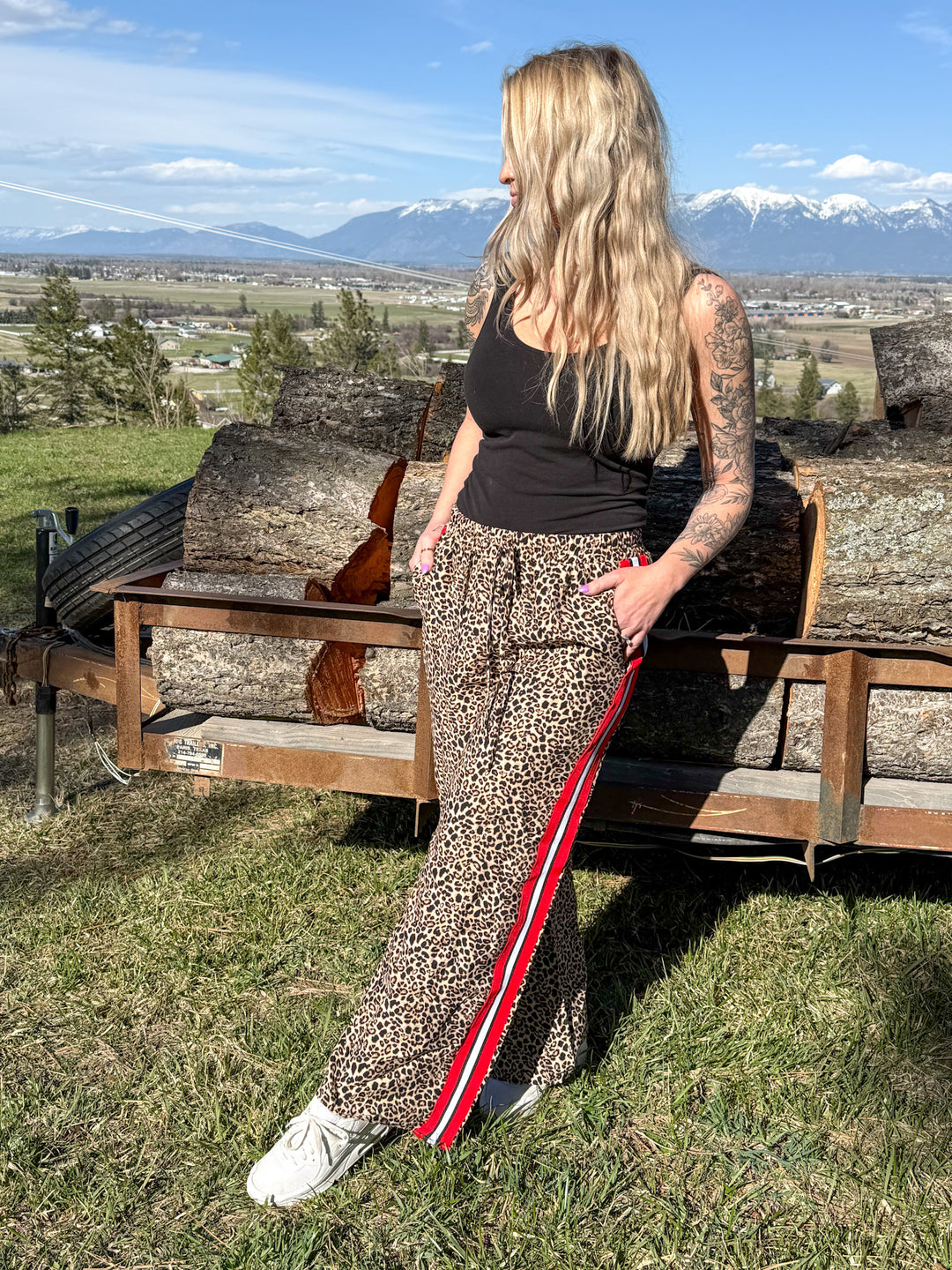The Penelope Pants - all-over leopard print with a bold red contrast side panel, wide leg, elastic waistband.