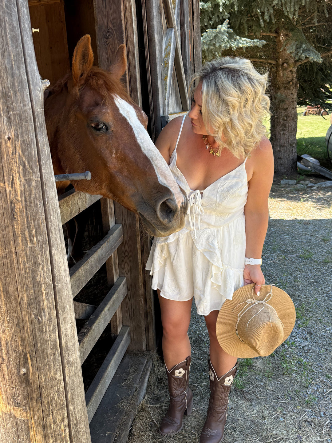 woven cowboy sun hat with beaded detailing and bow tie in the back. 