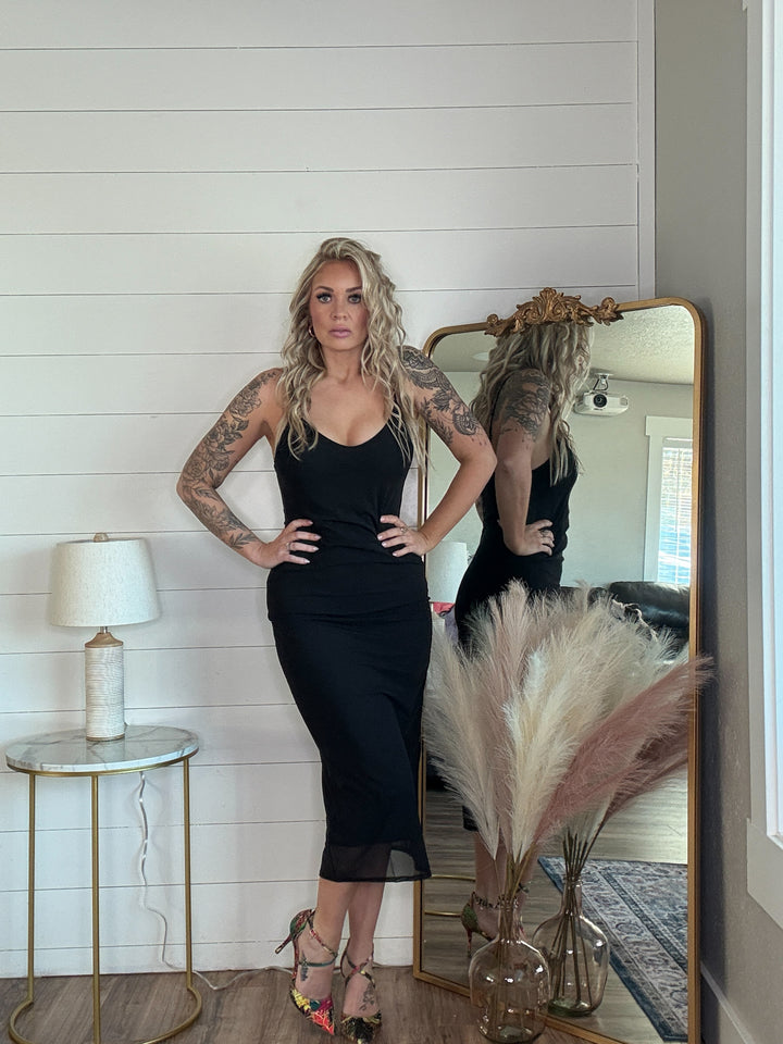 The Midnight Allure Midi Dress - flattering body-hugging fit, featuring a deep V-neckline, adjustable spaghetti straps, and a sheer mesh overlay