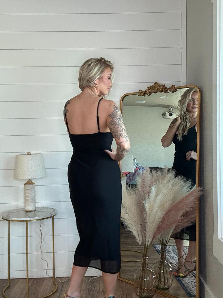 The Midnight Allure Midi Dress - flattering body-hugging fit, featuring a deep V-neckline, adjustable spaghetti straps, and a sheer mesh overlay