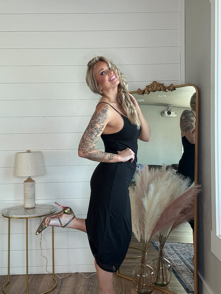 The Midnight Allure Midi Dress - flattering body-hugging fit, featuring a deep V-neckline, adjustable spaghetti straps, and a sheer mesh overlay