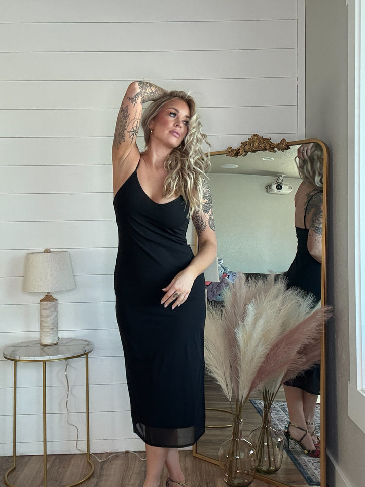 The Midnight Allure Midi Dress - flattering body-hugging fit, featuring a deep V-neckline, adjustable spaghetti straps, and a sheer mesh overlay