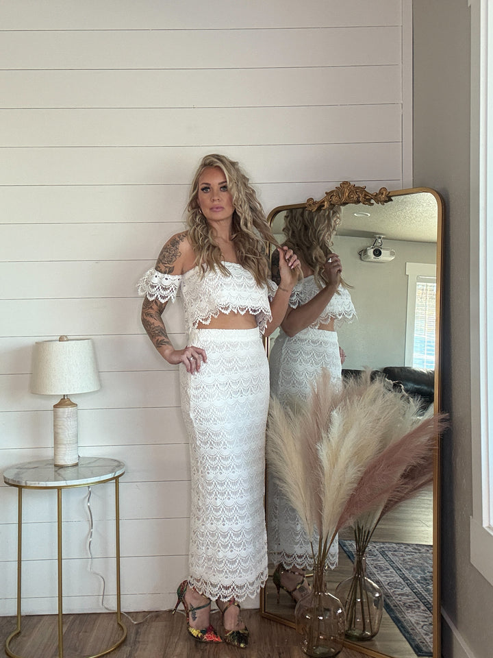 The Alycia Lace Crop Top - delicate lace detailing, a flattering off-the-shoulder neckline, and flutter sleeves