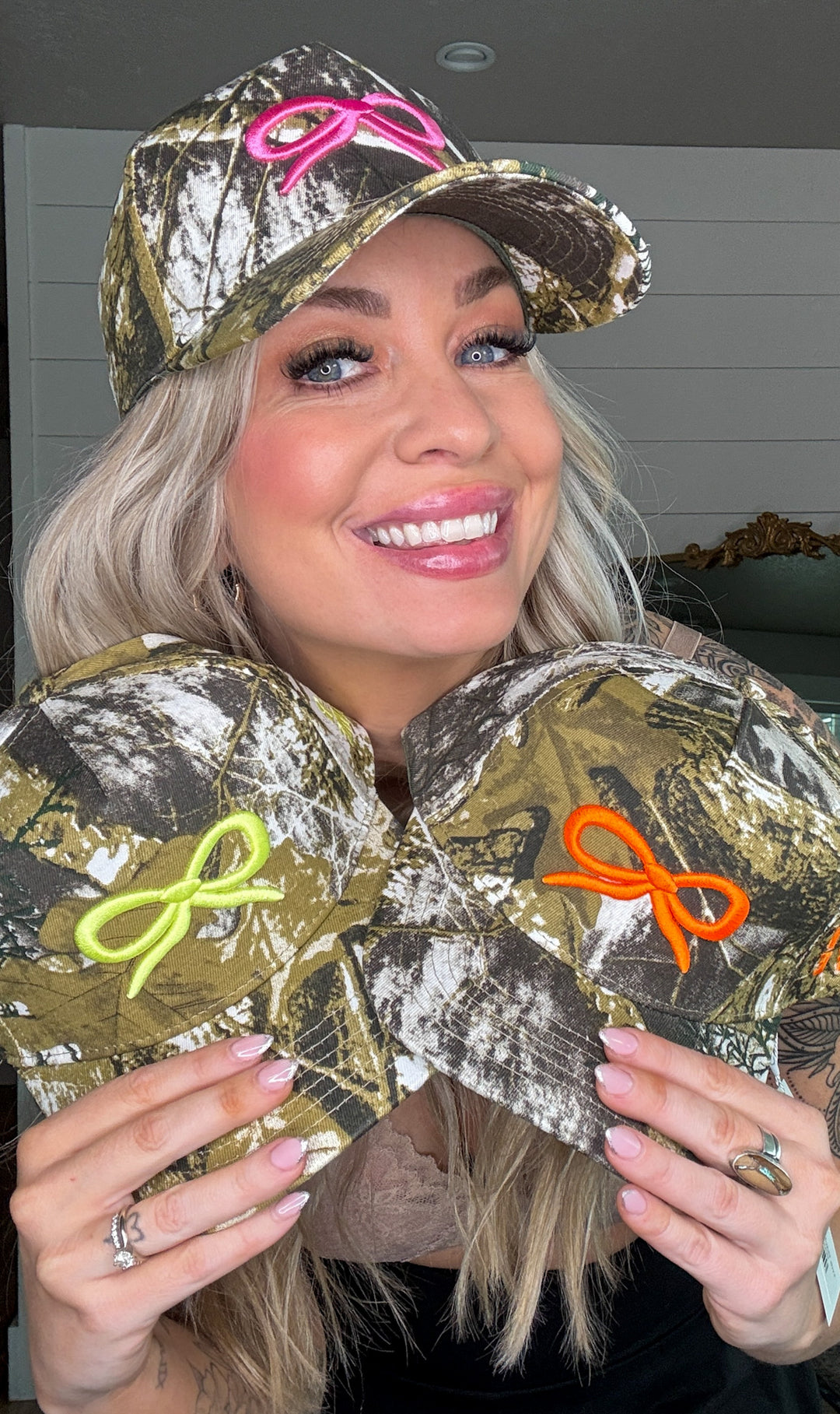 The Backroad Babe Hat - duck camo print, breathable mesh backing, and bold embroidery of a bow.