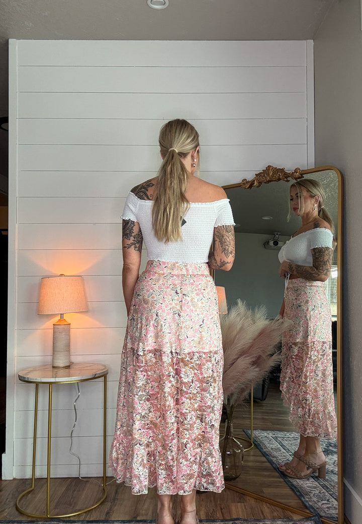The Meadow Maxi Skirt - high-waisted fit, soft ruffles, and a bold high-cut front with paisley design 