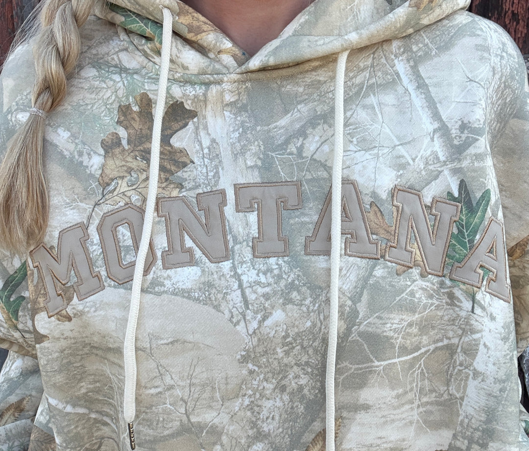 Hoodie with 'Montana' text on a camouflage pattern