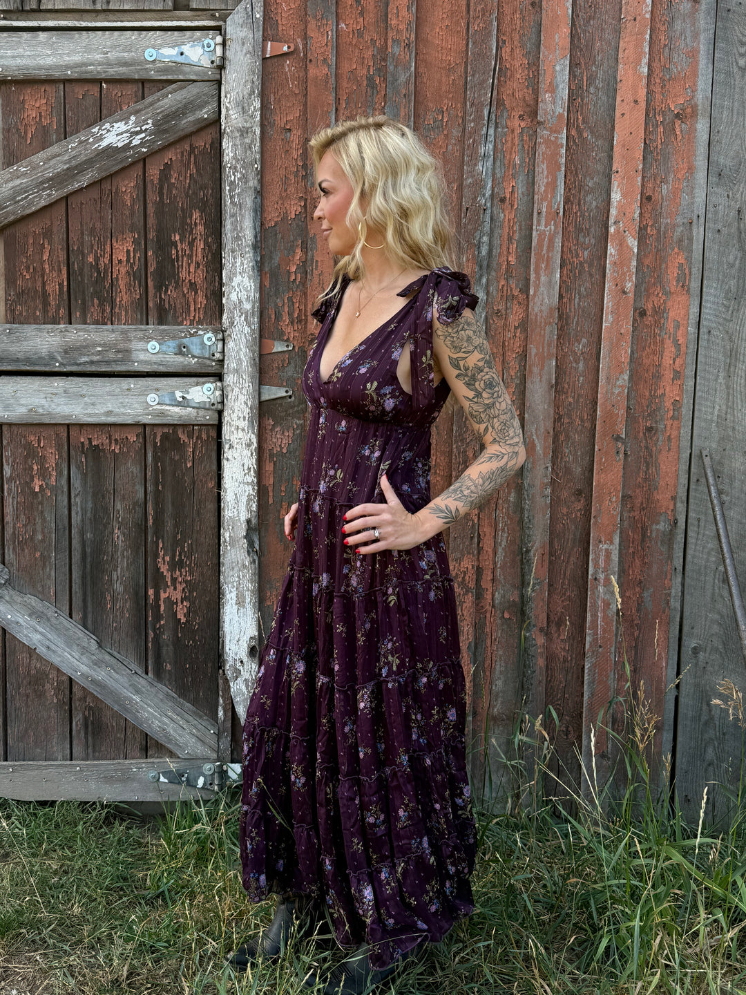 Woman in a dark purple flower dress 