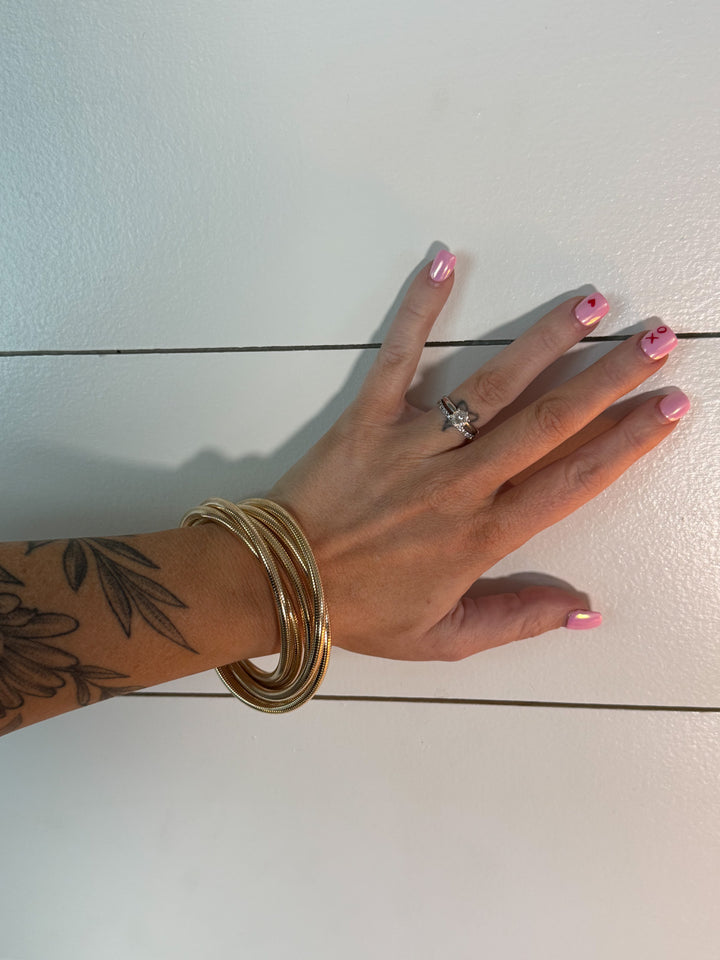 Golden Dunes Bracelet Stack - five interlocked bangles, stretchable 
