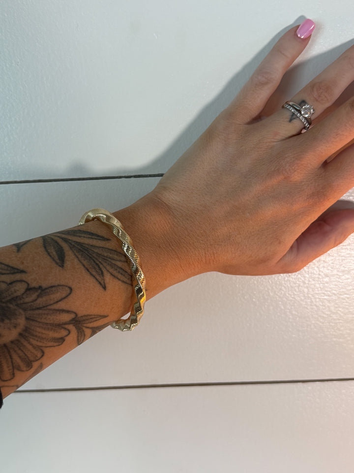 The Aspen Ridge Bangle - designed with a subtle, wave-like pattern, stretchable