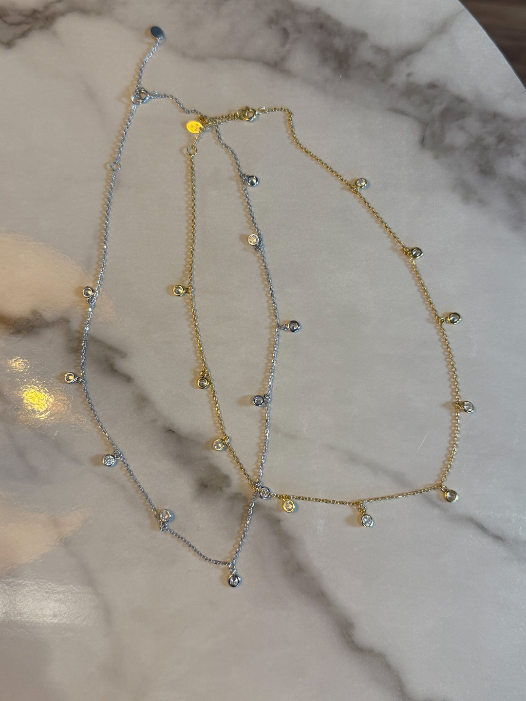 The Stella Drop Necklace - Crafted from 925 sterling silver, this dainty 13.5" chain features tiny bezel-set accents