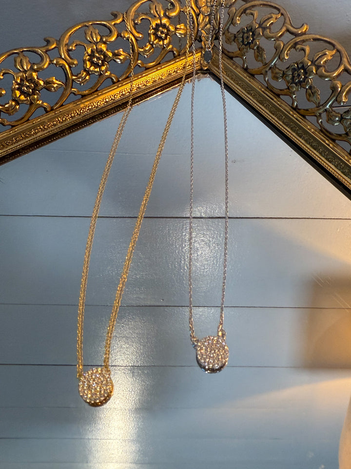 The Celeste Pendant Necklace - 925 sterling silver,  features a dazzling pavé crystal disc