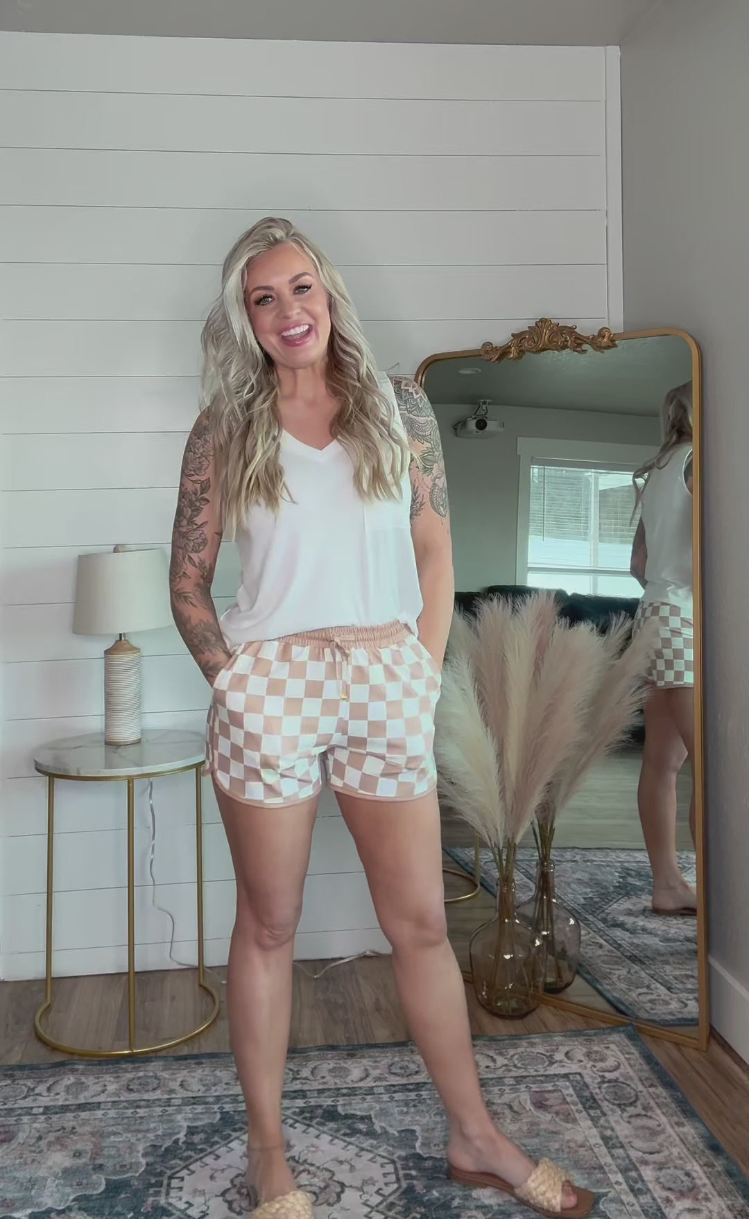 The Checkmate Shorts - mid-rise,  tie waist drawstring for adjustability, and side pockets for convenience,  relaxed fit. neutral checkered print